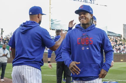 Apr 10, 2023; Chicago, Illinois, USA; Chicago Cubs pitcher Marcus Stroman (R) smiles before a baseball game against the Seattle Mariners at Wrigley Field. Mandatory Credit: Kamil Krzaczynski-USA TODAY Sports