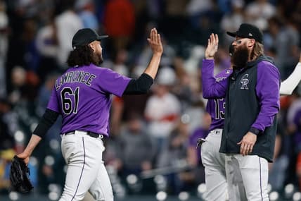 Apr 10, 2023; Denver, Colorado, USA; Colorado Rockies relief pitcher Justin Lawrence (61) reacts with designated hitter Charlie Blackmon (19) after the game against the St. Louis Cardinals at Coors Field. Mandatory Credit: Isaiah J. Downing-USA TODAY Sports