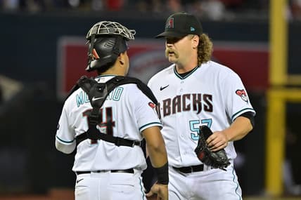 Apr 10, 2023; Phoenix, Arizona, USA; Arizona Diamondbacks relief pitcher Andrew Chafin (57) celebrates with catcher Gabriel Moreno (14) after beating the Milwaukee Brewers at Chase Field. Mandatory Credit: Matt Kartozian-USA TODAY Sports