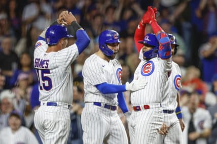 Apr 11, 2023; Chicago, Illinois, USA; Chicago Cubs center fielder Nelson Velazquez (right) celebrates with teammates as he crosses home plate after hitting a grand slam against the Seattle Mariners during the third inning at Wrigley Field. Mandatory Credit: Kamil Krzaczynski-USA TODAY Sports