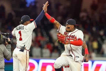 Apr 11, 2023; Atlanta, Georgia, USA; Atlanta Braves second baseman Ozzie Albies (1) and right fielder Ronald Acuna Jr. (13) celebrate a victory against the Cincinnati Reds at Truist Park. Mandatory Credit: Brett Davis-USA TODAY Sports