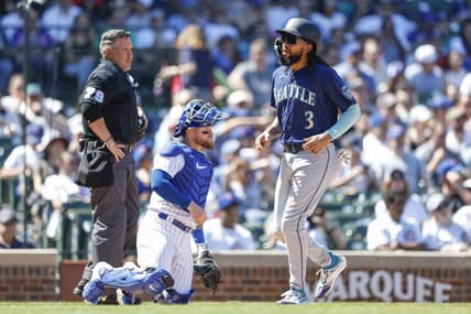 Apr 12, 2023; Chicago, Illinois, USA; Seattle Mariners shortstop J.P. Crawford (3) scores against the Chicago Cubs during the third inning at Wrigley Field. Mandatory Credit: Kamil Krzaczynski-USA TODAY Sports