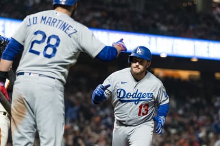 Apr 12, 2023; San Francisco, California, USA;  Los Angeles Dodgers third baseman Max Muncy (13) is congratulated by designated hitter J.D. Martinez (28) after he hit a solo home run against the San Francisco Giants during the fifth inning at Oracle Park. Mandatory Credit: John Hefti-USA TODAY Sports