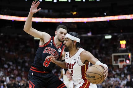 Apr 14, 2023; Miami, Florida, USA; Miami Heat guard Gabe Vincent (2) drives to the basket against Chicago Bulls guard Zach LaVine (8) during the second quarter at Kaseya Center. Mandatory Credit: Sam Navarro-USA TODAY Sports