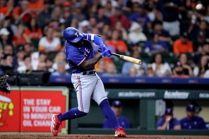 Apr 14, 2023; Houston, Texas, USA; Texas Rangers right fielder Adolis Garcia (53) hits a two-run home run to center field against the Houston Astros during the third inning at Minute Maid Park. Mandatory Credit: Erik Williams-USA TODAY Sports
