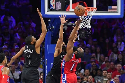 Apr 15, 2023; Philadelphia, Pennsylvania, USA; Philadelphia 76ers guard James Harden (1) reaches for ball  forward Mikal Bridges (1) during the first quarter of game one of the 2023 NBA playoffs at Wells Fargo Center. Mandatory Credit: Eric Hartline-USA TODAY Sports
