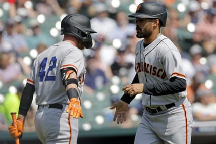 Apr 15, 2023; Detroit, Michigan, USA;  San Francisco Giants first baseman LaMonte Wade Jr. (right) celebrates with fielder Matt Beaty (left) after scoring against the Detroit Tigers in the first inning at Comerica Park. Mandatory Credit: Rick Osentoski-USA TODAY Sports