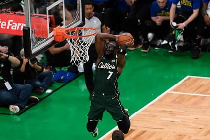 Apr 15, 2023; Boston, Massachusetts, USA; Boston Celtics guard Jaylen Brown (7) dunks against the Atlanta Hawks during the second quarter of game one of the 2023 NBA playoffs at TD Garden. Mandatory Credit: Eric Canha-USA TODAY Sports