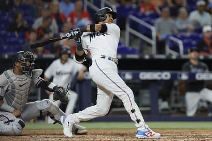 Apr 15, 2023; Miami, Florida, USA; Miami Marlins second baseman Luis Arraez (42) hits an RBI single during the seventh inning against the Arizona Diamondbacks at loanDepot Park. Mandatory Credit: Sam Navarro-USA TODAY Sports