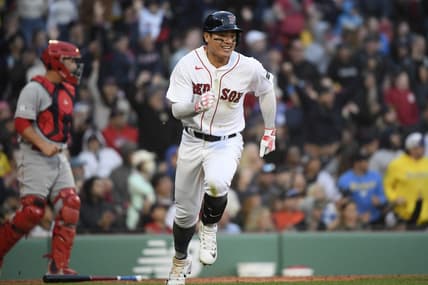 Apr 15, 2023; Boston, Massachusetts, USA; Boston Red Sox catcher Connor Wong (12) runs to first after hitting an RBI single during the eighth inning against the Los Angeles Angels at Fenway Park. Mandatory Credit: Bob DeChiara-USA TODAY Sports