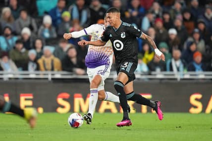 Apr 15, 2023; Saint Paul, Minnesota, USA; Minnesota United FC midfielder Kervin Arriaga (33) dribbles the ball as Orlando City SC defender Rodrigo Schlegel (15) chases during the first half at Allianz Field. Mandatory Credit: Brace Hemmelgarn-USA TODAY Sports