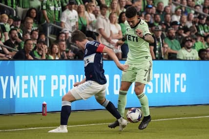 Apr 15, 2023; Austin, Texas, USA; Austin FC midfielder Emiliano Rigoni (7) fights for ball against NJ/NY Gotham FC player during the game at Q2 Stadium. Mandatory Credit: Scott Wachter-USA TODAY Sports
