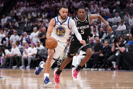 Apr 15, 2023; Sacramento, California, USA; Golden State Warriors guard Stephen Curry (30) dribbles past Sacramento Kings guard De'Aaron Fox (5) in the third quarter during game one of the 2023 NBA playoffs at the Golden 1 Center. Mandatory Credit: Cary Edmondson-USA TODAY Sports