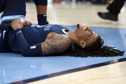 Apr 16, 2023; Memphis, Tennessee, USA; Memphis Grizzlies guard Ja Morant (12)reacts after falling to the ground during the second half during game one of the 2023 NBA playoffs against the Los Angeles Lakers at FedExForum. Mandatory Credit: Petre Thomas-USA TODAY Sports
