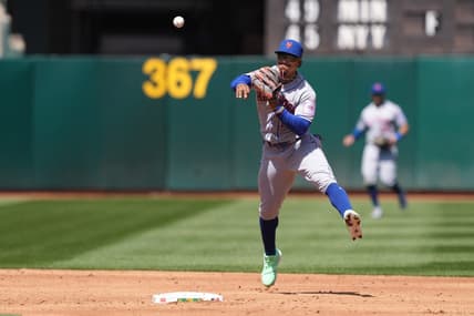 Apr 16, 2023; Oakland, California, USA; New York Mets shortstop Francisco Lindor (12) throws the ball to first base to record an out against the Oakland Athletics during the third inning at RingCentral Coliseum. Mandatory Credit: Darren Yamashita-USA TODAY Sports