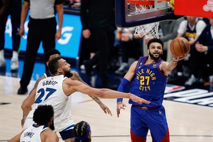 Apr 16, 2023; Denver, Colorado, USA; Denver Nuggets guard Jamal Murray (27)d rives to the net against Minnesota Timberwolves center Rudy Gobert (27) in the third quarter during game one of the 2023 NBA Playoffs at Ball Arena. Mandatory Credit: Isaiah J. Downing-USA TODAY Sports