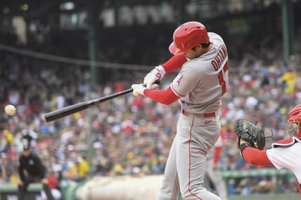 Apr 17, 2023; Boston, Massachusetts, USA;  Los Angeles Angels designated hitter Shohei Ohtani (17) hits a single during the first inning against the Boston Red Sox at Fenway Park. Mandatory Credit: Bob DeChiara-USA TODAY Sports
