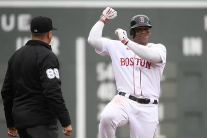 Apr 17, 2023; Boston, Massachusetts, USA;  Boston Red Sox third baseman Rafael Devers (11) reacts after hitting a double against the Los Angeles Angels during the fourth inning at Fenway Park. Mandatory Credit: Bob DeChiara-USA TODAY Sports
