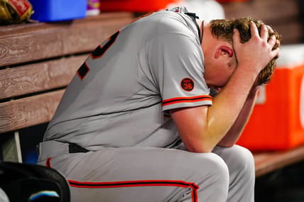 Apr 17, 2023; Miami, Florida, USA; San Francisco Giants starting pitcher Logan Webb (62) sits in the dug out after giving up a two-run home run against the Miami Marlins during the seventh inning at loanDepot Park. Mandatory Credit: Rich Storry-USA TODAY Sports