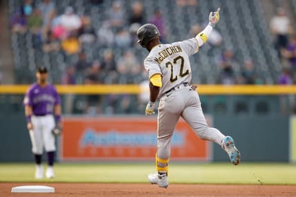 Apr 17, 2023; Denver, Colorado, USA; Pittsburgh Pirates designated hitter Andrew McCutchen (22) raises his hand as he rounds the bases on a solo home run in the first inning against the Colorado Rockies at Coors Field. Mandatory Credit: Isaiah J. Downing-USA TODAY Sports