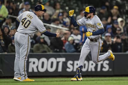 Apr 17, 2023; Seattle, Washington, USA; Milwaukee Brewers pinch hitter Brice Turang (0) is congratulated by third base coach Jason Lane while rounding the bases after hitting a solo home run seventh inning against the Seattle Mariners at T-Mobile Park. Mandatory Credit: Stephen Brashear-USA TODAY Sports