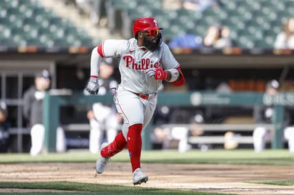 Apr 18, 2023; Chicago, Illinois, USA; Philadelphia Phillies second baseman Josh Harrison (2) runs to first base after hitting a two-run single against the Chicago White Sox during the third inning of game one of the doubleheader at Guaranteed Rate Field. Mandatory Credit: Kamil Krzaczynski-USA TODAY Sports