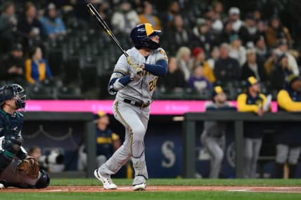 Apr 18, 2023; Seattle, Washington, USA; Milwaukee Brewers left fielder Christian Yelich (22) hits a home run against the Seattle Mariners during the first inning at T-Mobile Park. Mandatory Credit: Steven Bisig-USA TODAY Sports
