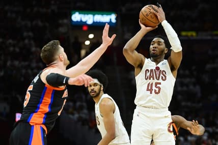 Apr 18, 2023; Cleveland, Ohio, USA; Cleveland Cavaliers guard Donovan Mitchell (45) shoots over the defense of New York Knicks center Isaiah Hartenstein (55) during the second half of game two of the 2023 NBA playoffs at Rocket Mortgage FieldHouse. Mandatory Credit: Ken Blaze-USA TODAY Sports