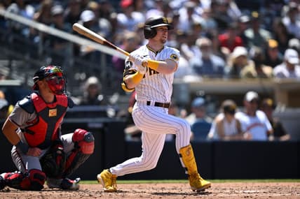 Apr 19, 2023; San Diego, California, USA; San Diego Padres first baseman Jake Cronenworth (9) hits a double against the Atlanta Braves during the fourth inning at Petco Park. Mandatory Credit: Orlando Ramirez-USA TODAY Sports