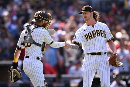 Apr 19, 2023; San Diego, California, USA; San Diego Padres catcher Austin Nola (26) and relief pitcher Josh Hader (71) shake hands after defeating the Atlanta Braves at Petco Park. Mandatory Credit: Orlando Ramirez-USA TODAY Sports