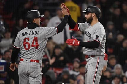 Apr 19, 2023; Boston, Massachusetts, USA;  Minnesota Twins first baseman Joey Gallo (13) high fives third baseman Jose Miranda (64) after hitting a two-run home run during the third inning against the Boston Red Sox at Fenway Park. Mandatory Credit: Bob DeChiara-USA TODAY Sports