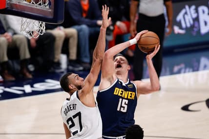 Apr 19, 2023; Denver, Colorado, USA; Denver Nuggets center Nikola Jokic (15) drives to the net against Minnesota Timberwolves center Rudy Gobert (27) in the second quarter during game two of the 2023 NBA Playoffs at Ball Arena. Mandatory Credit: Isaiah J. Downing-USA TODAY Sports