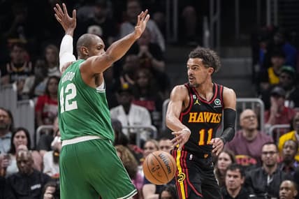 Apr 21, 2023; Atlanta, Georgia, USA; Atlanta Hawks guard Trae Young (11) passes behind Boston Celtics center Al Horford (42) during the first half during game three of the 2023 NBA playoffs at State Farm Arena. Mandatory Credit: Dale Zanine-USA TODAY Sports