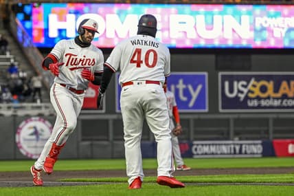 Apr 21, 2023; Minneapolis, Minnesota, USA; Minnesota Twins infielder Joey Gallo (left) celebrates his solo home run against the Washington National with third base coach Tommy Watkins (40) during the third inning at Target Field. Mandatory Credit: Nick Wosika-USA TODAY Sports
