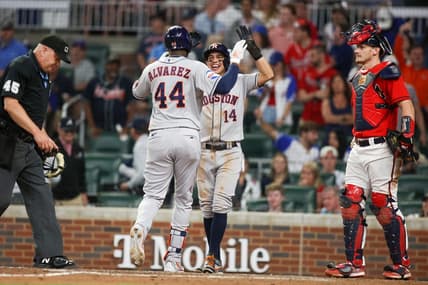Apr 21, 2023; Atlanta, Georgia, USA; Houston Astros left fielder Yordan Alvarez (44) celebrates after a home run with second baseman Mauricio Dubon (14) against the Atlanta Braves in the ninth inning at Truist Park. Mandatory Credit: Brett Davis-USA TODAY Sports
