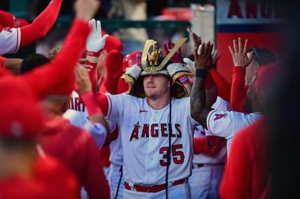 Apr 21, 2023; Anaheim, California, USA; Los Angeles Angels catcher Chad Wallach (35) is greeted after hitting a two run home run against the Kansas City Royals during the third inning at Angel Stadium. Mandatory Credit: Gary A. Vasquez-USA TODAY Sports