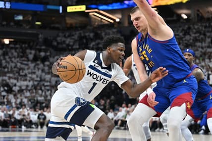Apr 21, 2023; Minneapolis, Minnesota, USA; Minnesota Timberwolves guard Anthony Edwards (1) goes to the basket as Denver Nuggets center Nikola Jokic (15) defends during the fourth quarter of game three of the 2023 NBA Playoffs at Target Center. Mandatory Credit: Jeffrey Becker-USA TODAY Sports