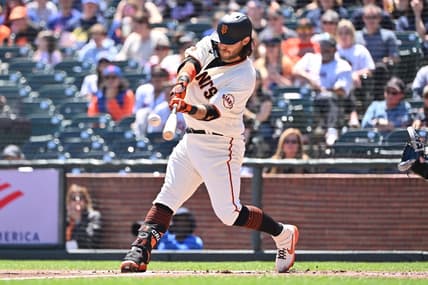 Apr 22, 2023; San Francisco, California, USA; San Francisco Giants infielder Brandon Crawford (35) hits a three run home run against New York Mets starting pitcher David Peterson (23) during the first inning at Oracle Park. Mandatory Credit: Robert Edwards-USA TODAY Sports