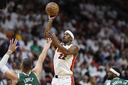 Apr 22, 2023; Miami, Florida, USA; Miami Heat forward Jimmy Butler (22) shoots the basketball over Milwaukee Bucks center Brook Lopez (11) in the first quarter during game three of the 2023 NBA Playoffs at Kaseya Center. Mandatory Credit: Sam Navarro-USA TODAY Sports