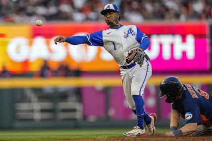 Apr 22, 2023; Cumberland, Georgia, USA; Atlanta Braves second baseman Ozzie Albies (1) throws to first base for a double play next to Houston Astros center fielder Jake Meyers (6) during the second inning at Truist Park. Mandatory Credit: Dale Zanine-USA TODAY Sports