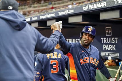 Apr 22, 2023; Cumberland, Georgia, USA; Houston Astros designated hitter Yordan Alvarez (44) reacts in the dugout with manager Dusty Baker (12) after hitting a two run home run against the Atlanta Braves during the sixth inning at Truist Park. Mandatory Credit: Dale Zanine-USA TODAY Sports