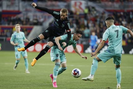 Apr 22, 2023; Sandy, Utah, USA; San Jose Earthquakes midfielder Jackson Yueill (14) challenges Real Salt Lake defender Bryan Oviedo (3) in the first half at America First Field. Mandatory Credit: Jeffrey Swinger-USA TODAY Sports