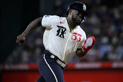 Apr 22, 2023; Arlington, Texas, USA; Texas Rangers right fielder Adolis Garcia (53) scores against the Oakland Athletics during the game at Globe Life Field. Mandatory Credit: Jerome Miron-USA TODAY Sports