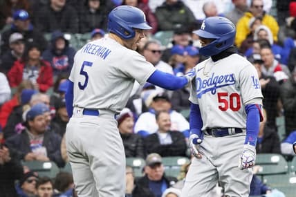 Apr 23, 2023; Chicago, Illinois, USA; Los Angeles Dodgers right fielder Mookie Betts (50) is greeted by first baseman Freddie Freeman (5) after hitting a two-run homer against the Chicago Cubs during the third inning at Wrigley Field. Mandatory Credit: David Banks-USA TODAY Sports