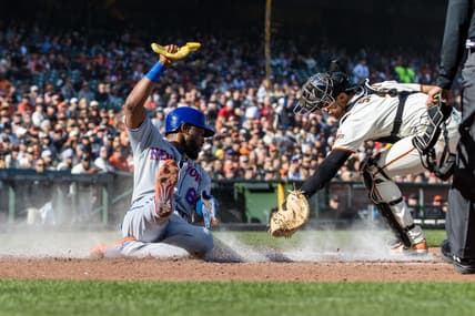 Apr 23, 2023; San Francisco, California, USA; New York Mets right fielder Starling Marte (6) slides home to score in front of San Francisco Giants catcher Blake Sabol (2) during the third inning at Oracle Park. Mandatory Credit: John Hefti-USA TODAY Sports