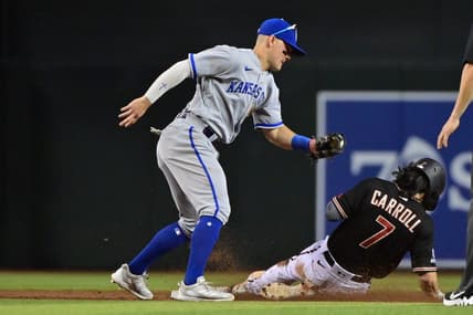 Apr 24, 2023; Phoenix, Arizona, USA; Arizona Diamondbacks left fielder Corbin Carroll (7) steals second base on Kansas City Royals second baseman Michael Massey (19) in the third inning at Chase Field. Mandatory Credit: Matt Kartozian-USA TODAY Sports