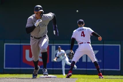 Apr 26, 2023; Minneapolis, Minnesota, USA; New York Yankees designated hitter Aaron Judge (99) runs to third on a sacrifice fly against the Minnesota Twins during the first inning at Target Field. Mandatory Credit: Nick Wosika-USA TODAY Sports