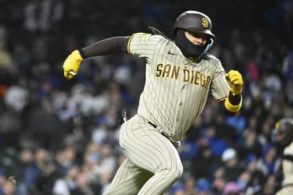 Apr 26, 2023; Chicago, Illinois, USA;  San Diego Padres right fielder Fernando Tatis Jr. (23) runs to first after he hits a two RBI single against the Chicago Cubs during the seventh inning at Wrigley Field. Mandatory Credit: Matt Marton-USA TODAY Sports