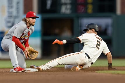 Apr 26, 2023; San Francisco, California, USA; St. Louis Cardinals second baseman Brendan Donovan (33) awaits the ball as San Francisco Giants catcher Blake Sabol (2) steals second base during the fourth inning at Oracle Park. Mandatory Credit: John Hefti-USA TODAY Sports