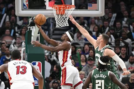 Apr 26, 2023; Milwaukee, Wisconsin, USA; Miami Heat forward Jimmy Butler (22) shoots the ball against Milwaukee Bucks center Brook Lopez (11)during game five of the 2023 NBA Playoffs at Fiserv Forum. Mandatory Credit: Michael McLoone-USA TODAY Sports